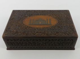 An Indian carved hardwood stationery box, 9cm x 30cm.