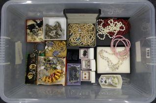 A box of mixed costume jewellery including some silver items.