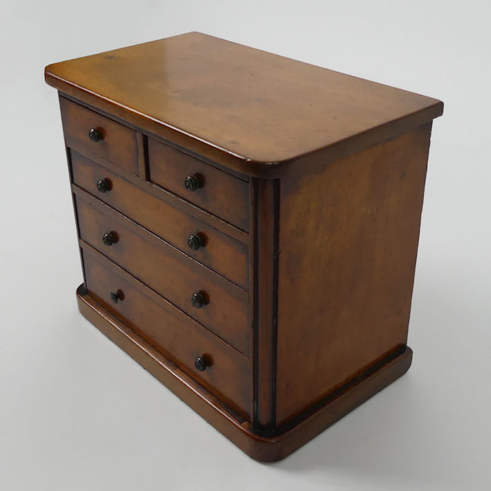 An Edwardian mahogany two over three miniature chest of drawers 20cm x 23cm. - Image 2 of 3