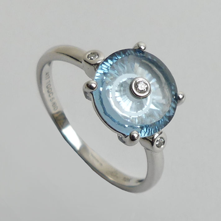 10ct white gold white sapphire and blue topaz ring, 2.1 grams. Size L 1/2 8.8 mm wide.