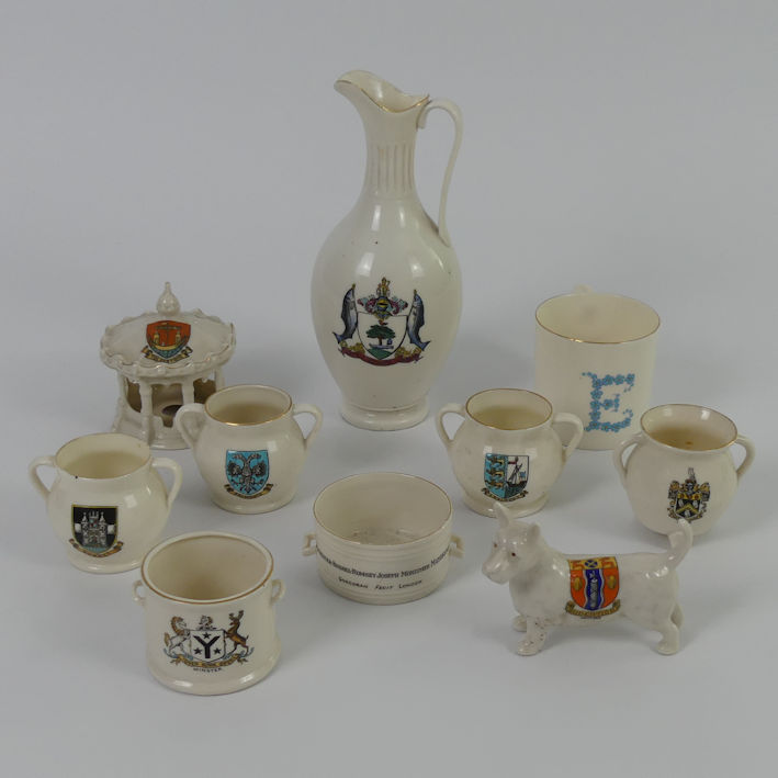 Ten crested ware items including a large Goss jug and an Arcadian bandstand 20cm.