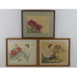 Three framed and glazed Japanese woodblocks with flora and fauna, 32cm x 39cm.