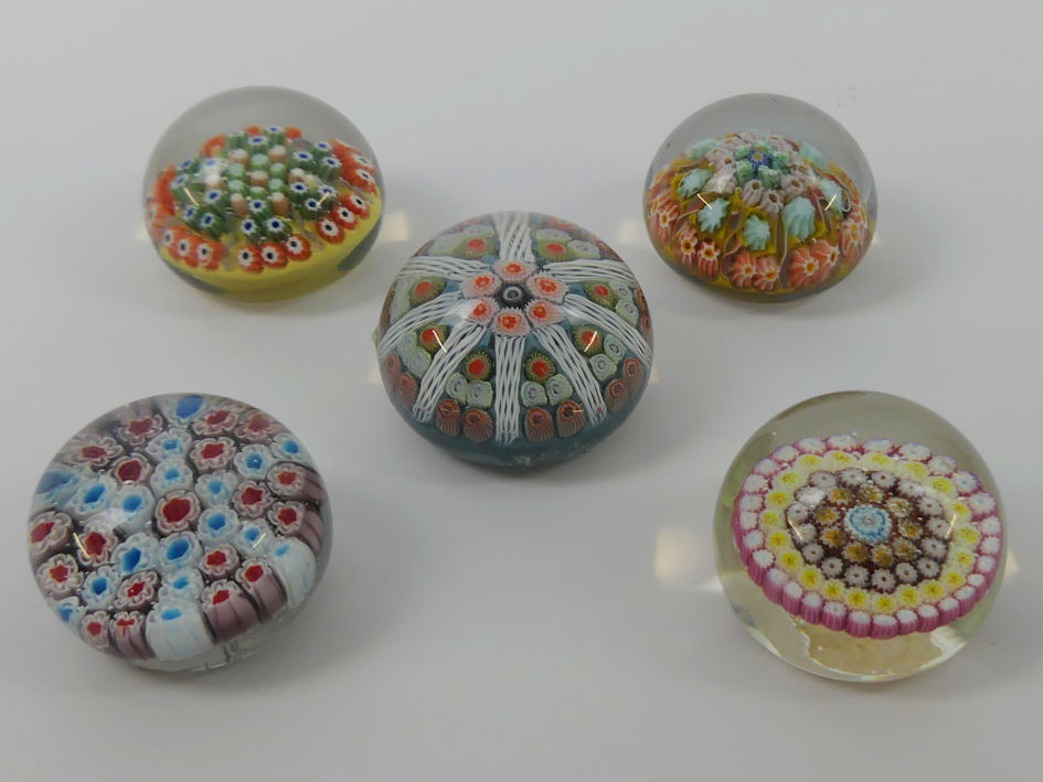 Five millefiori glass paperweights including Caithness and Strathearn.