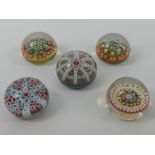 Five millefiori glass paperweights including Caithness and Strathearn.