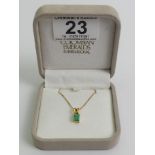 18ct gold Columbian emerald pendant on a 14ct chain, 2.6 grams, pendant 13.mm x 5.5mm.