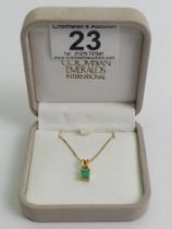 18ct gold Columbian emerald pendant on a 14ct chain, 2.6 grams, pendant 13.mm x 5.5mm.