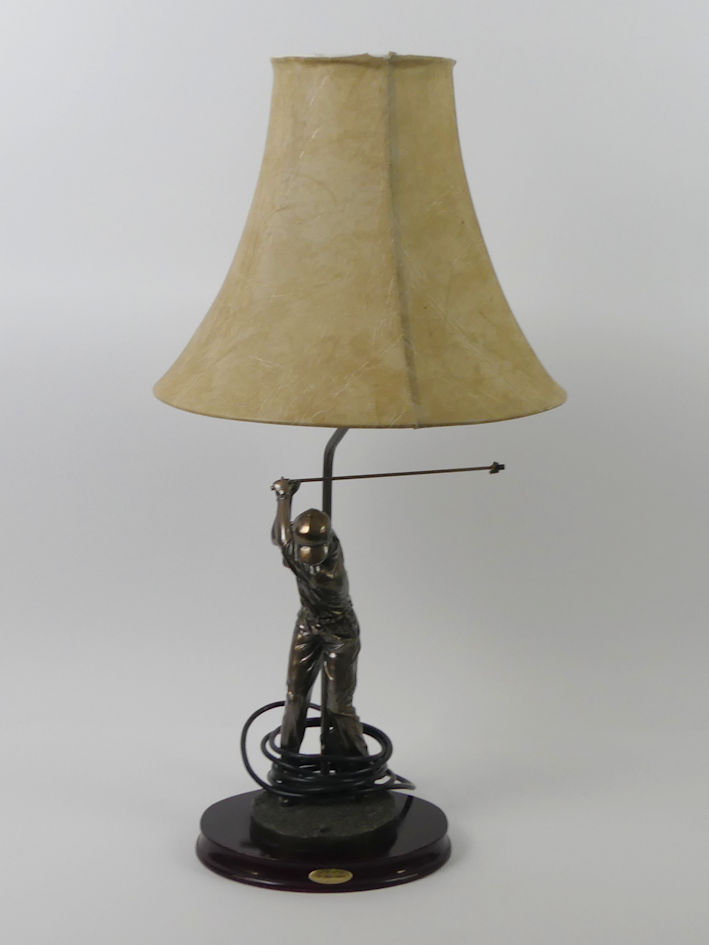 A bronzed figural table lamp in the form of a golfer together with a framed golfing print 63 x 47