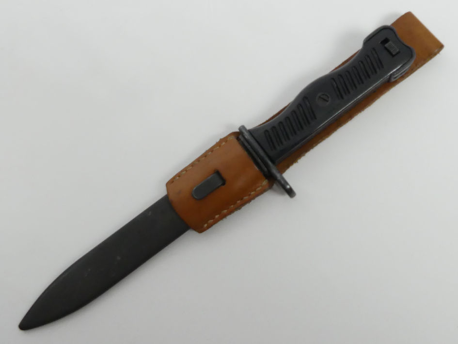 A vintage Yugoslavian M56 Sub-Machine gun bayonet with scabbard, blade 17cm.