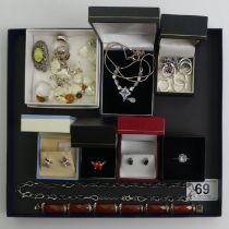 A selection of silver items including a topaz and diamond ring, a carnelian bracelet and silver