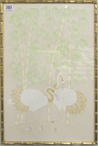 A framed and glazed Japanese silk of Cranes in a bamboo style frame, 58cm x 42cm.