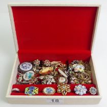 A jewellery box and contents including several pairs of 9ct gold earrings.