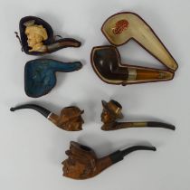 A collection of pipes including a silver mounted meerschaum pipe, and a Perkins silver mounted pipe.