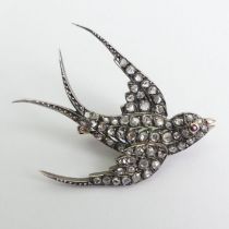 Victorian diamond and ruby swallow design bird brooch, 8.3 grams. 47 x 38 mm.
