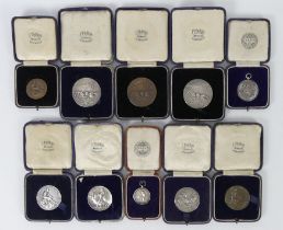 Ten army sports medals including a hall marked silver cricket medal.