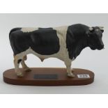 A Beswick Friesian bull on a wooden plinth designed by Graham Tongue, A2580, 19cm x 29cm