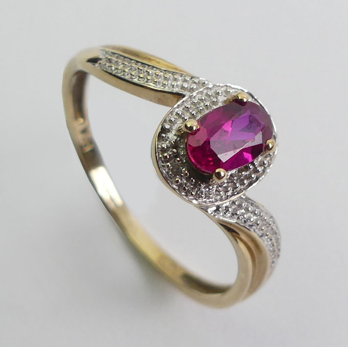 9ct gold ruby and diamond ring, 1.8 grams, 9mm, size R.
