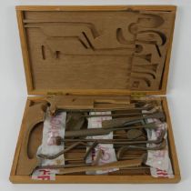 An old boxed set of thatcher's tools 37cm wide.