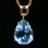 9ct gold blue topaz pendant and chain, 6 grams, pendant 25mm x 12.5mm.