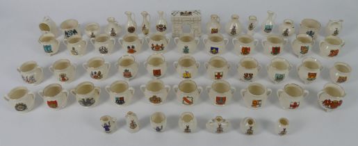 A box of crested ware, mainly Goss.