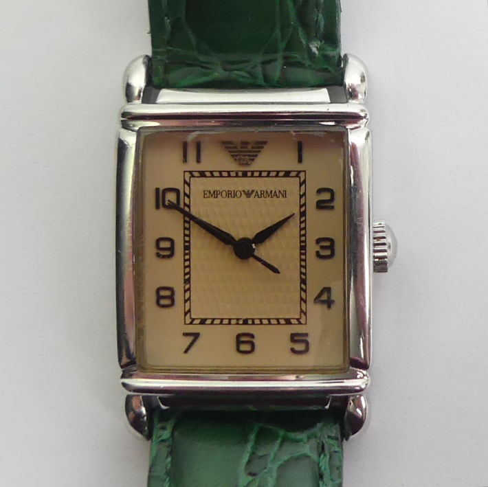 Emporio Armani quartz movement watch on a green leather strap. 24 x 36 mm. Condition report: In good