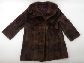 A mink fur jacket together with a mink fur stole.