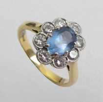 18ct gold blue topaz and diamond ring, 3.3 grams. Size J 1/2 12.3 mm wide.
