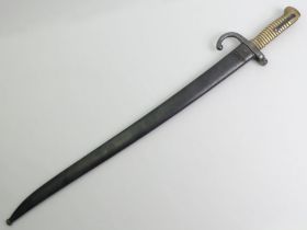 French Chassepot bayonet and scabbard, the signed blade dated 1872. Blade 57 cm long.