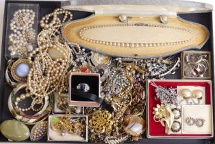 A box of mixed jewellery including a silver and CZ tennis bracelet and silver rings.