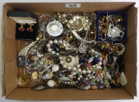 A box of mixed costume jewellery including silver and crystal necklaces.