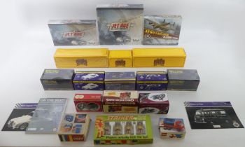 A box of toys including lego, boxed diecast vehicles and striker football players.