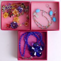 Boxed Butler and Wilson multi-coloured crystal floral design necklace and bracelet, a blue floral