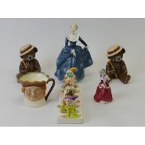 Royal Doulton Character jug, Royal Doulton figurines and a Disney toast rack. Tallest figure 20cm.