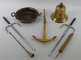 A box of brassware including a bell dated 1939, an anchor and a jam pot.