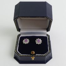 A pair of 9ct white gold pink topaz and diamond earrings, 2.8 grams, 11mm 9.5mm.