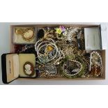 A box of mixed costume jewellery including silver chains.