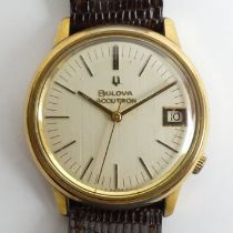 Bulova Accutron date adjust gold tone watch. 35 mm diameter.