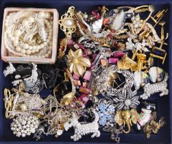 A box of mixed costume jewellery including a silver tree of life necklace and earrings.