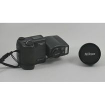 A Nikon Coolpix 990 digital camera.