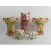 A pair of Art Deco Arthur Wood pottery vases, a lustre vase and two pig money boxes, tallest vase