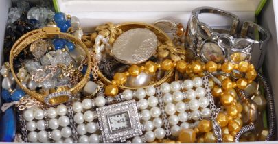 A box of mixed costume jewellery and watches including a large silver locket and an orange stone