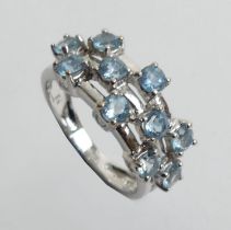 9ct white gold blue topaz ring, 3.3 grams. Size K 1/2 8.8 mm wide.