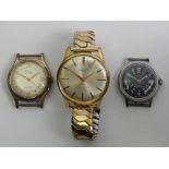 Three gents watches, a Seiko automatic gold tone watch, a Timex black dial watch and a Projects gold