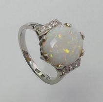 14ct white gold opal and diamond ring, 3.7 grams, 13.3mm, size J.