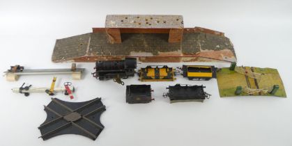 A box of Hornby 0 gauge, including a clockwork train, platform and track.