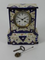 A Victorian china mantel clock striking on a bell, 28cm x 23cm.
