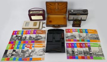 A box of items including Victorian photograph album and two Roberts radios.