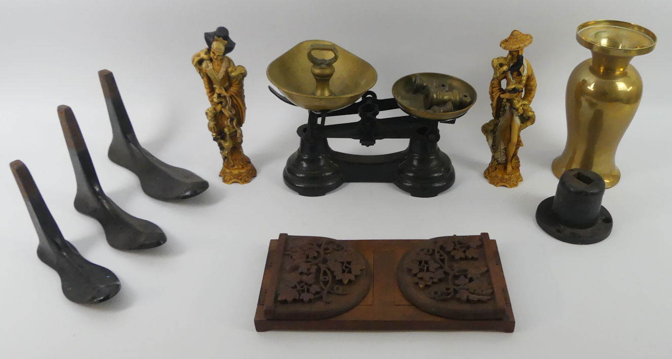 A box of items to include sets of scales and weights along with a book slide and a brass vase.