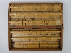 A vintage cased set of printer's blocks, 33cm x 76cm.