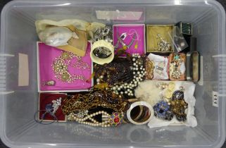 A box of mixed costume jewellery including silver items and hair combs.