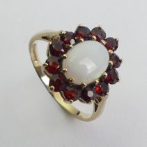 9ct gold opal and garnet cluster ring, 2.2 grams. Size L 1/2 14.4 mm wide.